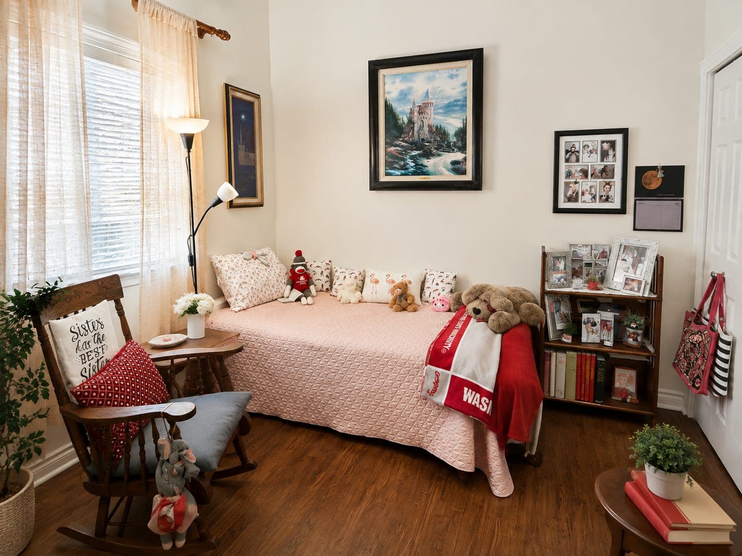 A bedroom with a made bed, a rocking chair beside it and daylight through the window.