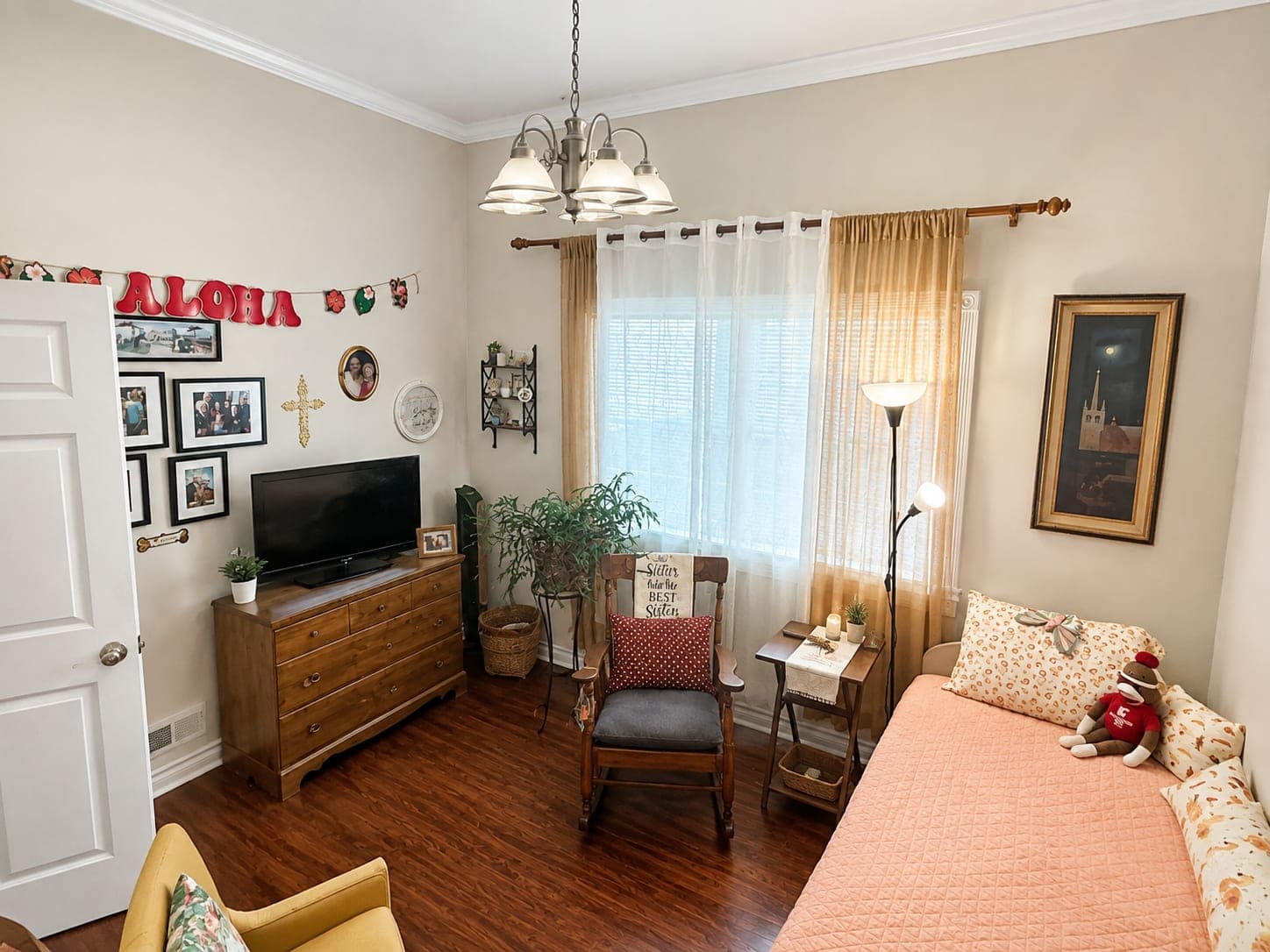 A second bedroom, with a seating corner beside the window.